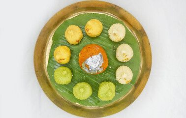 Modak and Laddu, Indian sweets, need for offerings delicious, cultural festival like Ganesh Chaturthi, Lord Krishna Janmastami, Durga Puja, Diwali celebration on white background. Selective focus.