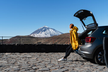 Woman traveling by car in area Mount Teide, El Teide National Park, Tenerife, Canary Islands, Spain. © nataliaderiabina