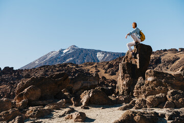 Person admiring the view of volcano Teide, Tenerife, Canary Islands, Spain.
