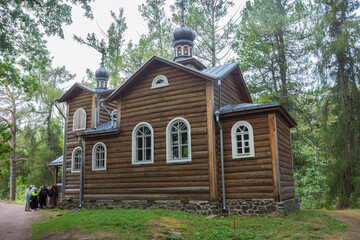 Church of Konevsky Skete. Valaam Island. Pilgrims at the entrance to the church