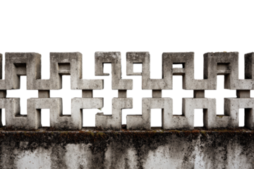 Aged decorative concrete block wall with geometric pattern.