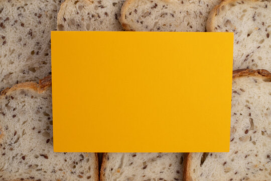 Bread slices and business card. Bakery branding mockup with empty space for your logo or design