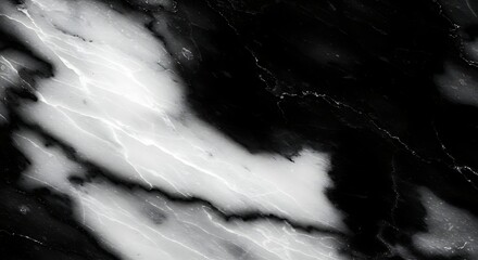 Black and white marble swirls across a polished surface, creating dramatic patterns and textures in a sophisticated and elegant style.