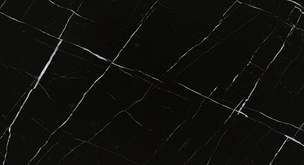 Black marble slab displaying intricate white veins creating a luxurious and sophisticated surface texture, perfect for modern interior design and highend architectural projects.
