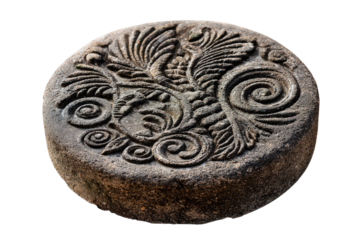 Ancient circular stone artifact with a mythical bird relief carving.