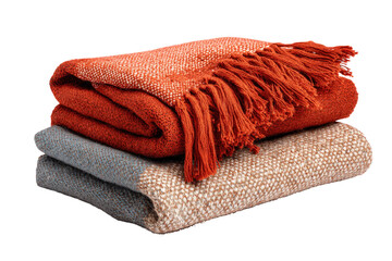 A neat stack of three colorful woven throw blankets.