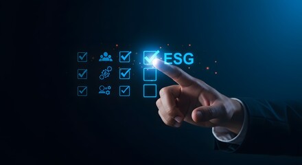 Hand pressing ESG button on futuristic interface for sustainable business