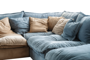 Plush and comfortable blue sectional sofa with numerous cushions.