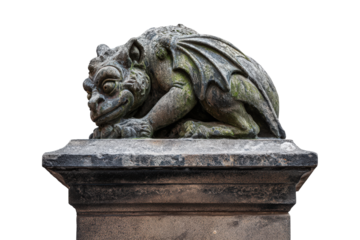 Ancient stone gargoyle statue sleeping on a pedestal.