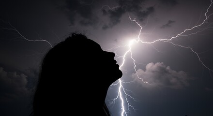 Silhouette figure facing storm