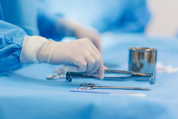Medical team prepares surgical instruments in a sterile environment for an operation