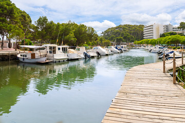 Obraz premium The Cala Galdana Marina in the Serpentona district of the seaside resort town of Cala Galdana, on the Mediterranean Island of Menorca, Spain.