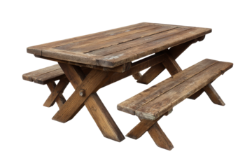 Old rustic wooden picnic table with attached benches isolated.