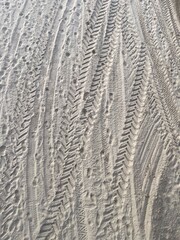 View from above on many tire tracks in the  sand