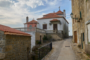 Historic stone street with traditional houses in Monsanto, Portugal.