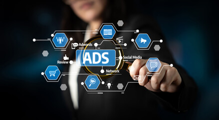 A business professional interacts with a virtual display of advertisement and social media icons, demonstrating innovative online marketing strategies in today digital landscape. Tessel