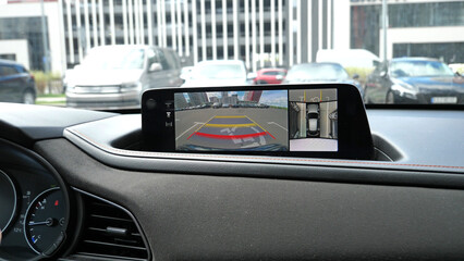 The sign for a parking space for the disabled person is visible via the front camera and...