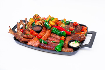 Appetizing platter of grilled meats, fried snacks, and vegetables, garnished with herbs. A hearty meal perfect for sharing