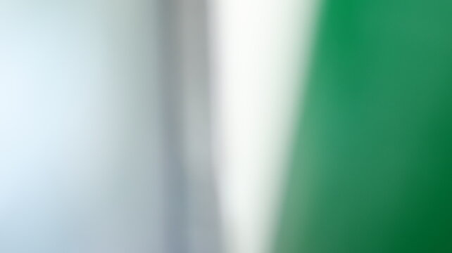 Blurry abstract green, white and gray gradient, soft focus background, elegant and fluid texture.