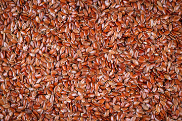 Organic linseed or flaxseed texture or surface as background.