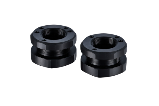 Two black, circular, machined components.  Multiple mounting holes.  High precision