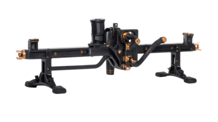 Dark, intricate mechanical device with brass accents,  mounted on support bases