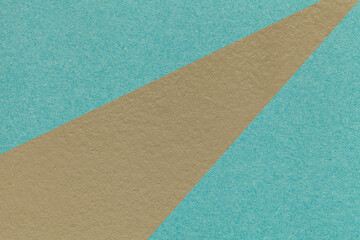 Abstract old geometric turquoise paper background with brown rays, macro texture for banner, template, presentation