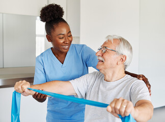 Doctor or nurse or physiotherapist caregiver exercise with senior man at clinic or nursing home