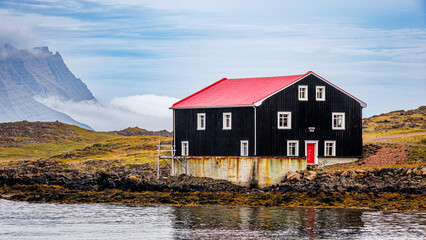 Building on the coast near the harbor in Djupivogur, Iceland