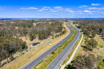 Drone aerial photograph of The Northern Road and surrounding area running through the suburb of Bringelly in the southwestern region of greater Sydney New South Wales, Australia. 