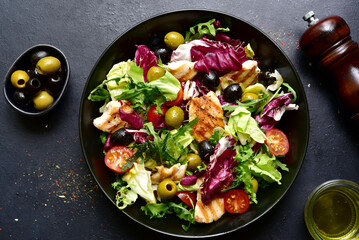 Green salad with grilled chicken fillet. Top view with copy space.