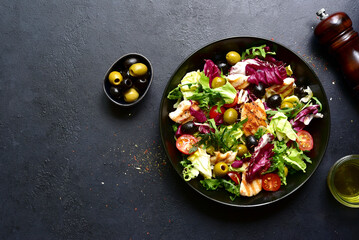 Green salad with grilled chicken fillet. Top view with copy space.