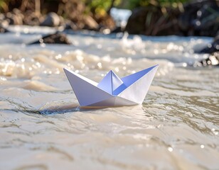 Paper boat on a flowing river
