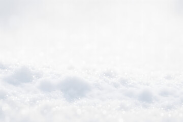 Obraz premium Closeup snowy surface with sparkling bokeh lights, winter background