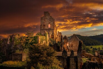 Fototapeta premium Sunset over historic castle ruins.