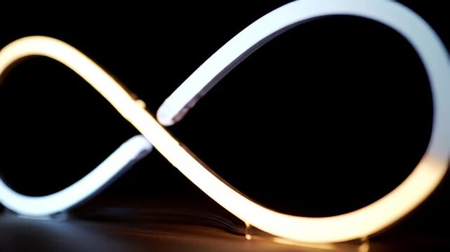 Illuminated Infinity Symbol Against a Black Background with Clean Curves and Bright Glow