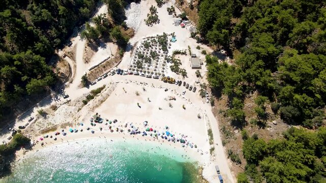 Porto Vathy beach, sand and umbrellas on beach, Thassos Island, Greece. One of the most beautiful beaches in Greece. Amazing beach with clear blue water. Aerial panoramic drone view from above, top vi