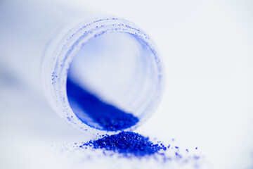 Close up of Blue Copper Peptides in Powder and Liquid Form