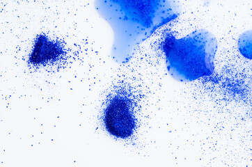 Close up of Blue Copper Peptides in Powder and Liquid Form