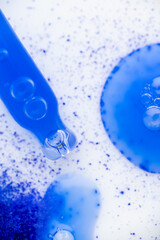 Close up of Blue Copper Peptides in Powder and Liquid Form