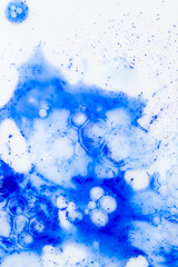 Close up of Blue Copper Peptides in Powder and Liquid Form