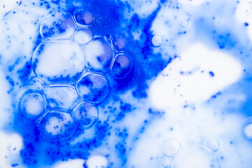 Close up of Blue Copper Peptides in Powder and Liquid Form