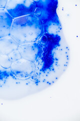 Close up of Blue Copper Peptides in Powder and Liquid Form