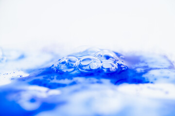 Close up of Blue Copper Peptides in Powder and Liquid Form