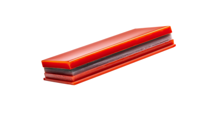 A  layered, rectangular confection.  Two  red  layers sandwich a darker layer.  Isolated  on  black