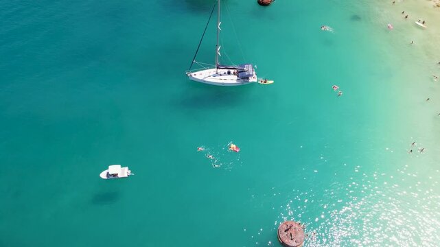 Yachts in sea on Porto Vathy beach, Thassos Island, Greece. Amazing beach with clear blue water. Aerial panoramic drone view from above, top view from drone. Summer holidays Europe
