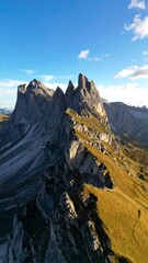 Alpine peaks, rugged cliffs, sunlit slopes