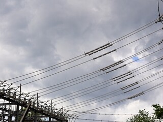 Transmission lines extending between substation frames