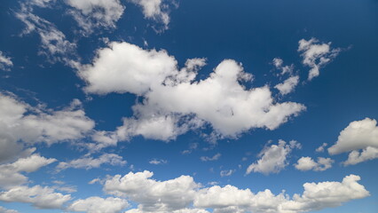 Enjoy the beautiful clear skies adorned with fluffy clouds, creating a serene atmosphere