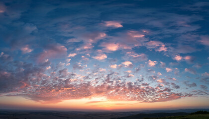 Obraz premium A Serene Sky With A Few Scattered Clouds Reflecting The Soft Colors Of Dawn The Clouds
